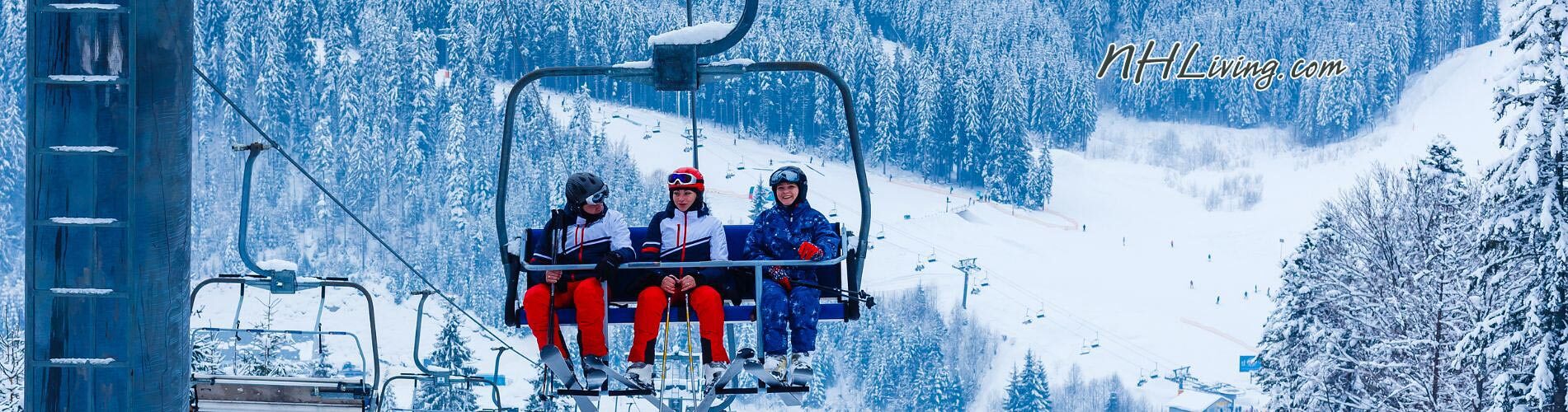 NH Winter vacation skiers on a NH Ski Resort Ski Lift
